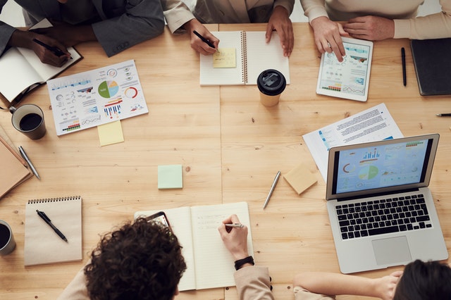 Overhead photo of a table with people working