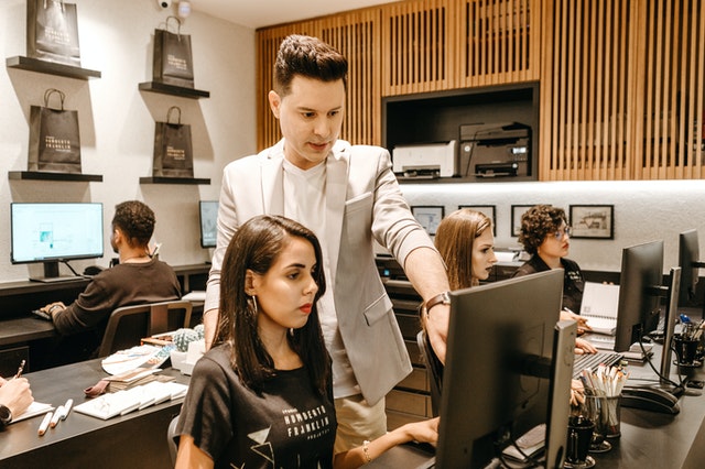 Man pointing at a computer screen